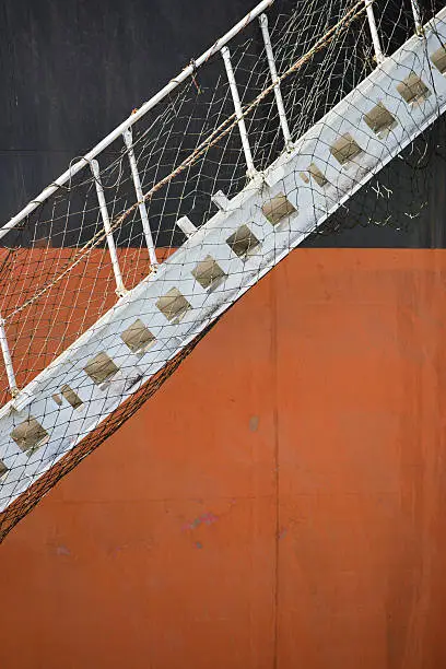 Gangway on red and black ship