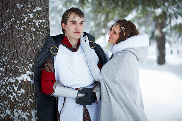 istock couple in medieval clothes in a snowy forest 531069572