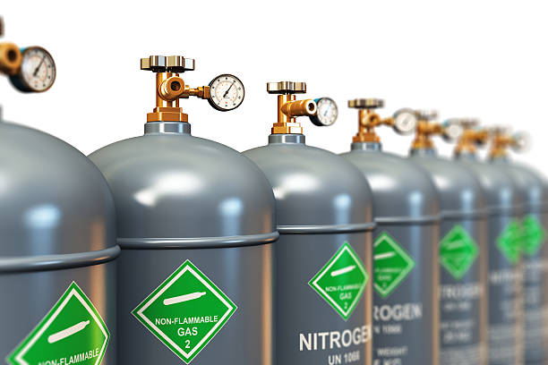 Row of liquefied nitrogen industrial gas containers stock photo
