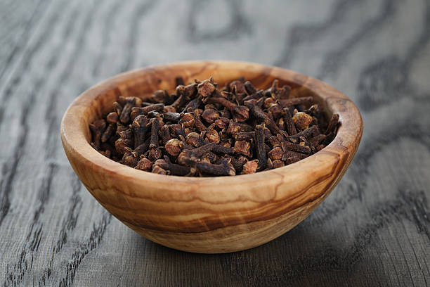 istock cloves in olive bowl on oak table 531071065