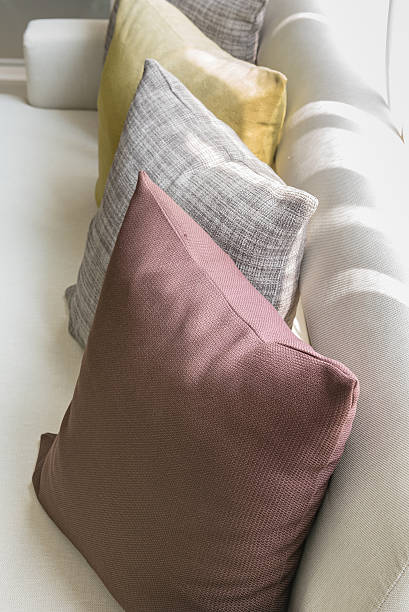 istock row of colorful pillows on white sofa 531071538