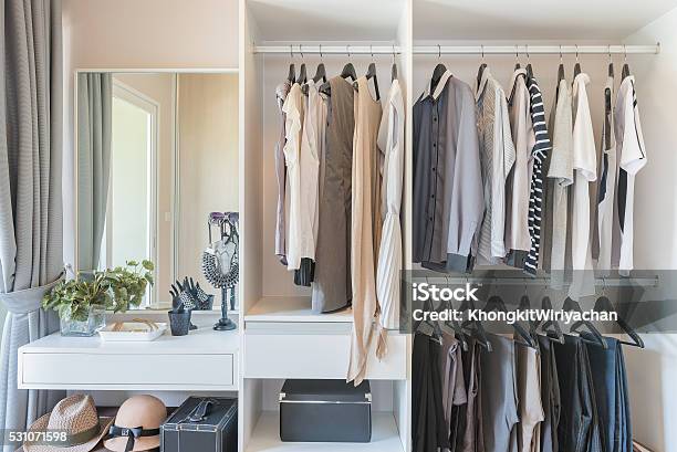 White Wardrobe With Shirts And Pants Hanging Stock Photo - Download Image Now - Closet, Clothing, Hanging