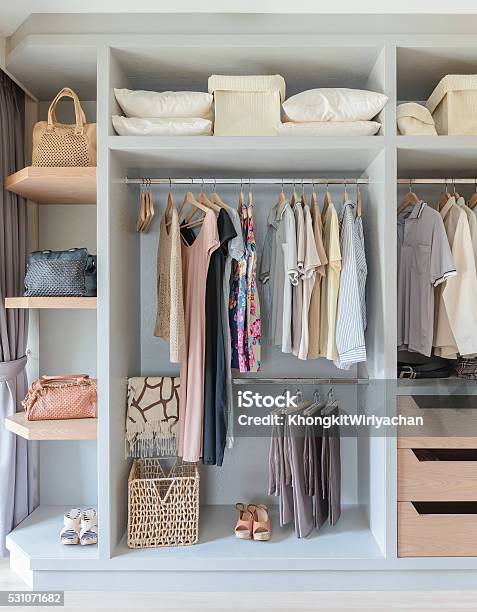 White Wardrobe With Shirts And Pants Hanging Stock Photo - Download Image Now - Closet, Fashion, No People