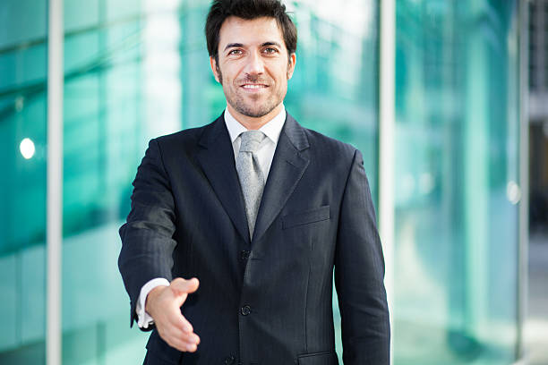 istock Handsome businessman giving you his hand 531072305