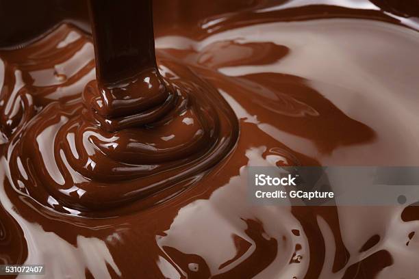 Melted Dark Chocolate Flow Stock Photo - Download Image Now - Chocolate, 2015, Backgrounds