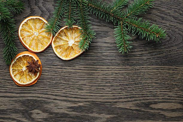 istock spruce twig with dried orange slices on oak table 531072429