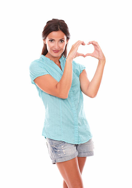 istock Smiling lady in short jeans making a love sign 531073451