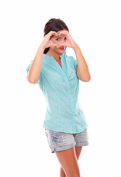 istock Pretty woman looking through a love sign 531073455