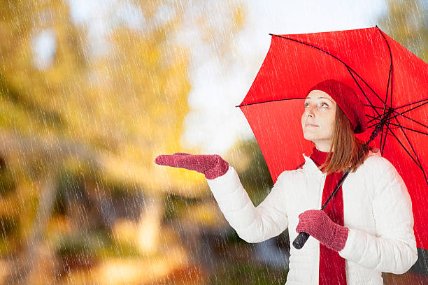 istock Young woman with red umbrella 531073759