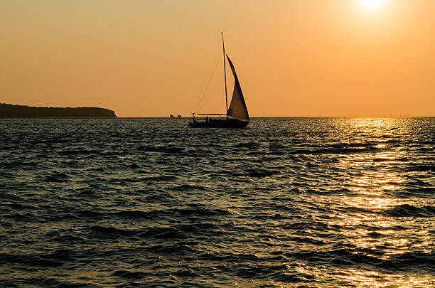 istock Sailboat in the sea at sunset 531075067