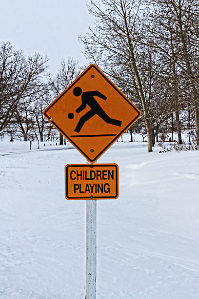 istock Children Playing Sign in Winter 531075987