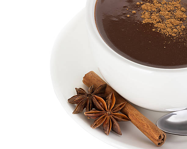 istock Hot chocolate with cinnamon and anise isolated on white background 531077275