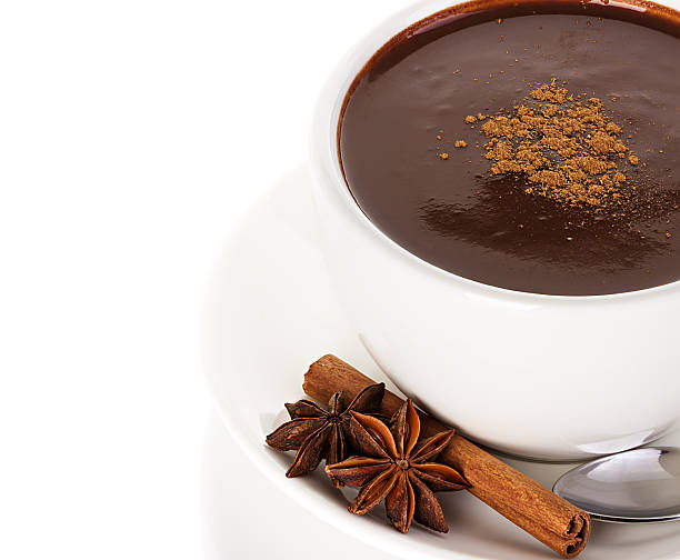 istock Hot chocolate with cinnamon and anise isolated on white background 531077425