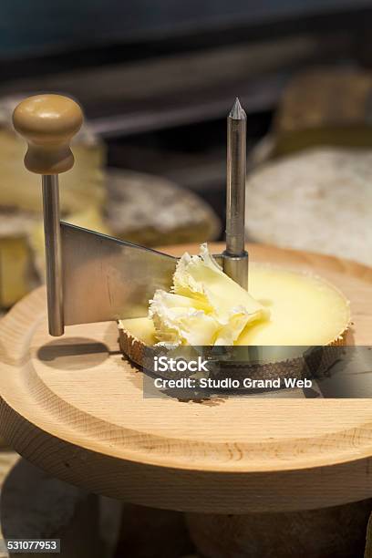 Tete De Moine Milk Cheese With Girolle On Cutting Board Stock Photo - Download Image Now