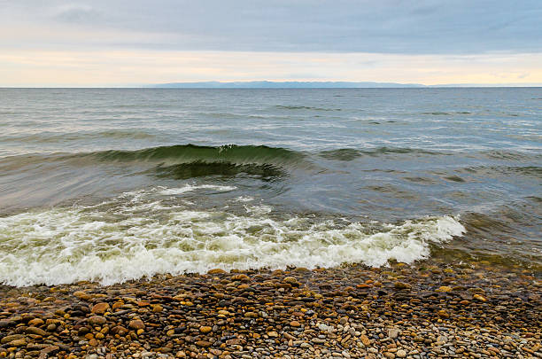Storm on the lake in September under a large steel cape