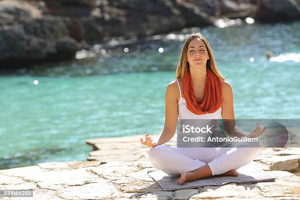 Relaxed Girl Doing Yoga Exercises On Holidays Stock Photo - Download Image Now - Breathing Exercise, Deep, 2015