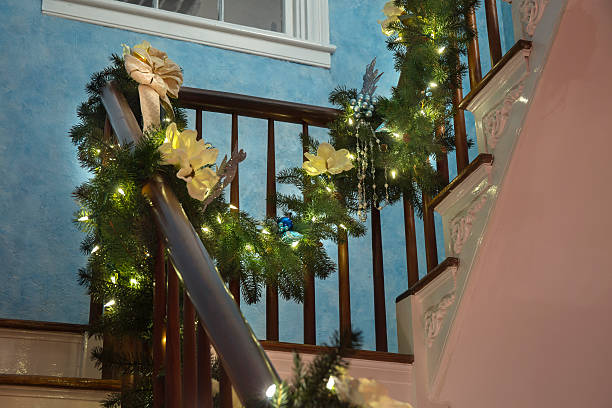 lighted christmas garland - christmas tree stockfoto's en -beelden
