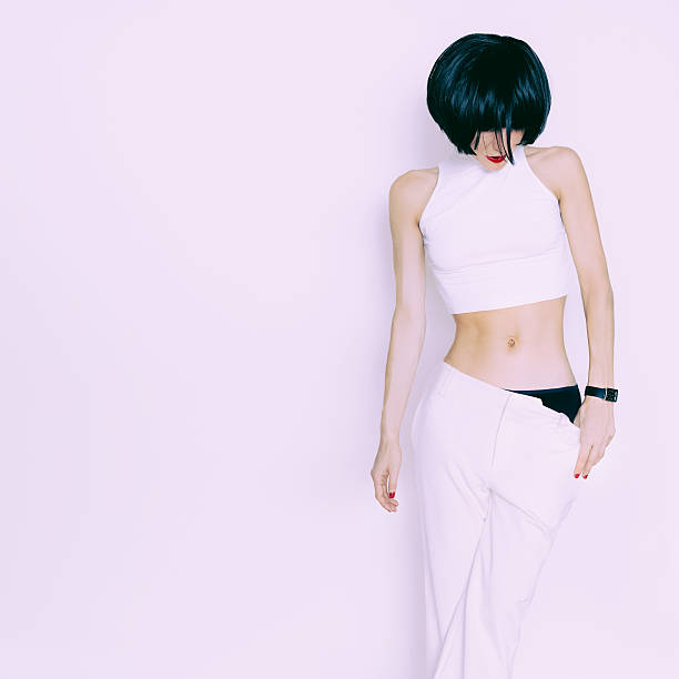 istock sensual brunette model on white background in white clothing 531095625