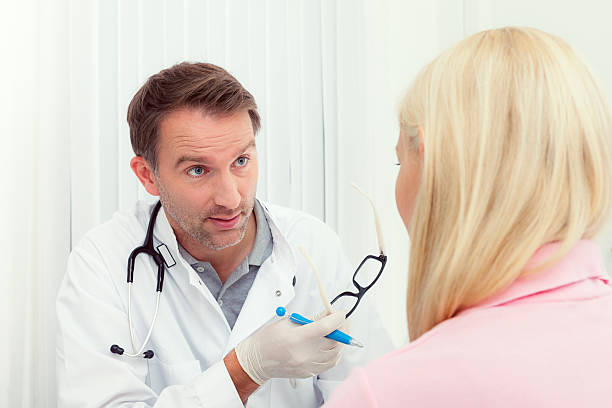 istock doctor in discussion with his female patient 531096135