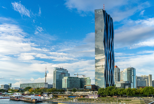 Vienna, Austria - September 21, 2014: View of Danube City Vienna with DC-Tower (Donau City Tower 1), a 220m skyscraper designed by architect Dominique Perrault.