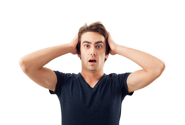 istock Amazed young man hand holding head 531099031