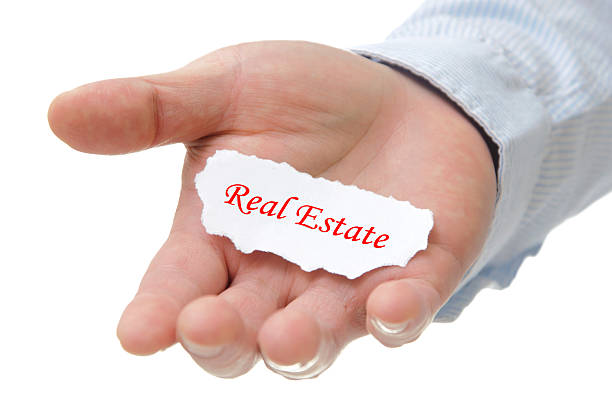 istock Business man holding real estate note on hand 531106337