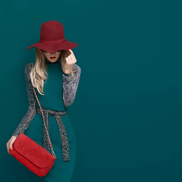 Lovely blond model in fashionable red hat stock photo