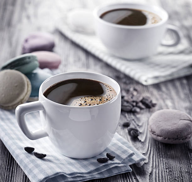 istock Cup of coffee and french macaron. 531107433