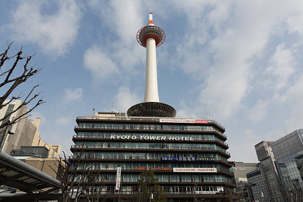 Kyoto Tower in Japan Kyoto, Japan - March 6, 2014: Kyoto Tower is an observation tower located in Karasuma-dori, Higashi Shiokoji-cho, Kyoto, Japan. This tower opening since December 28, 1964. kyoto tower hotel stock pictures, royalty-free photos & images