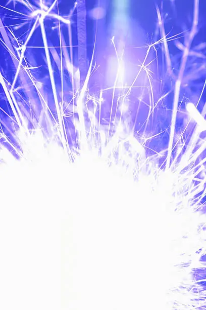 A brightly burning sparkler as a bright background.
