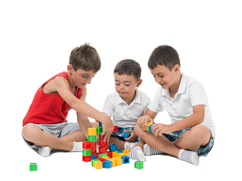 Three kids playing with toys