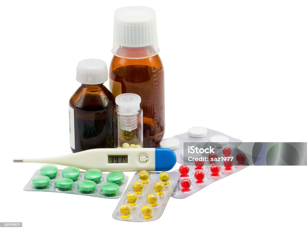 Medicines Pills, the thermometer and small bottles with medicines on a white background 2015 Stock Photo