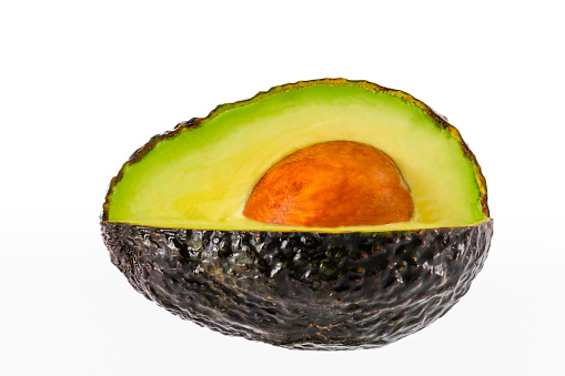 Cut avocado on white background