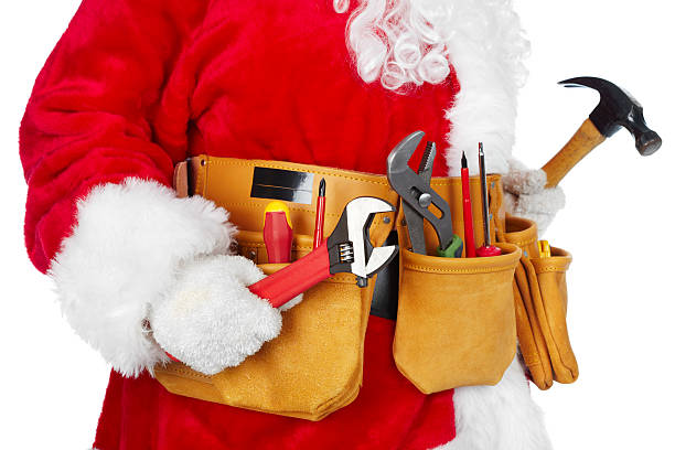 Santa Claus with a tool belt. stock photo