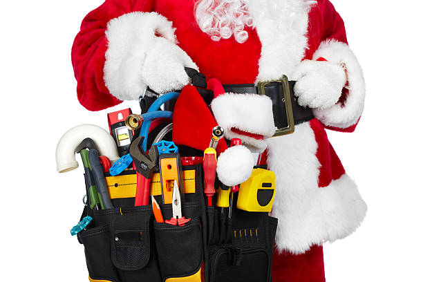 Santa Claus with a tool belt. stock photo