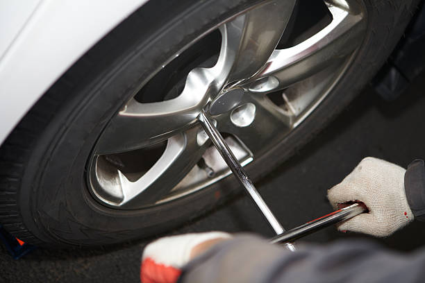 istock Car mechanic changing tire. 531120359