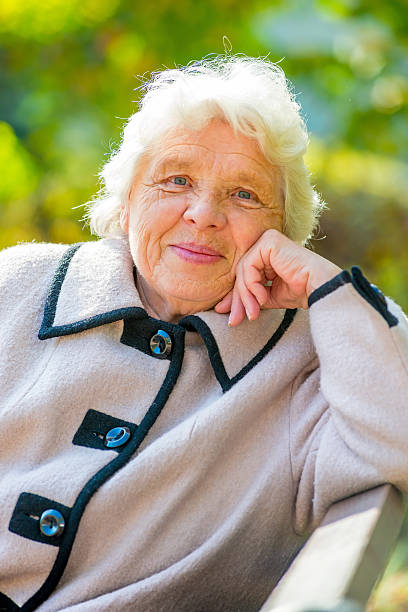 istock Smiling elderly pensioner rest on the nature in the park 531120539