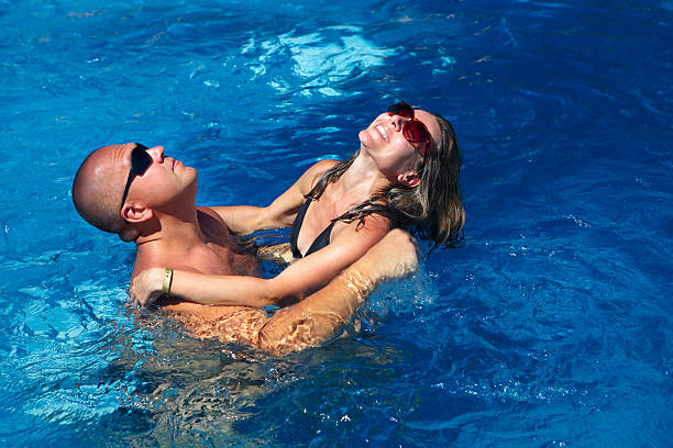 istock Loving couple in pool 531123813