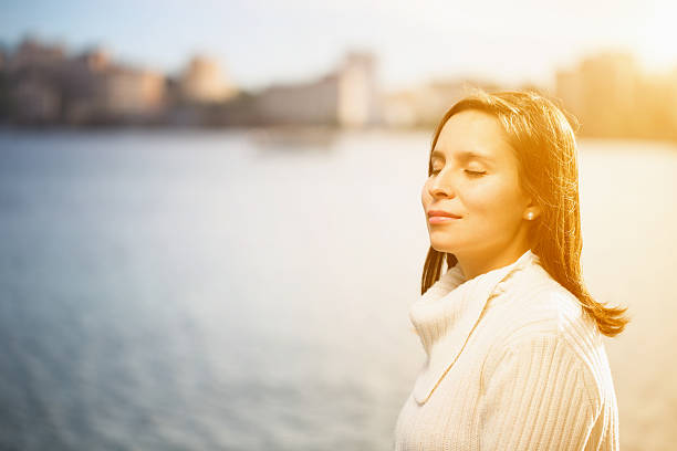 istock young latin woman on beach enjoying sun 531127799