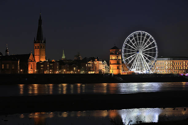 Dusseldorf Old Town nightview with ferris wheel stock photo
