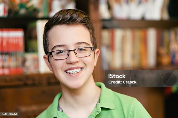 Happy Teenage Boy With Braces And Glasses Smiling Stock Photo - Download Image Now - Dental Braces, Boys, Human Teeth
