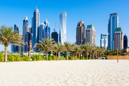 Horizontal view of skyscrapers and jumeirah beach in Dubai. UAE