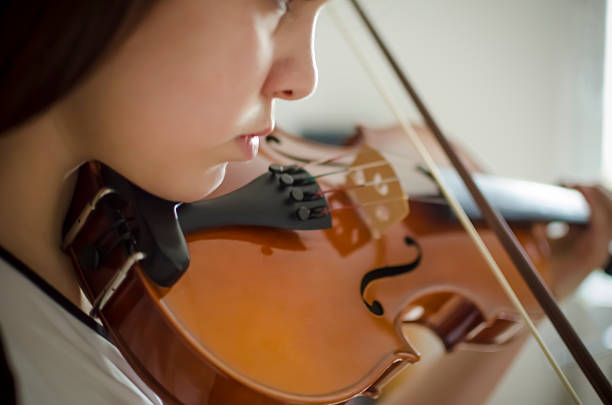 istock Young violinist playing violin 531135469