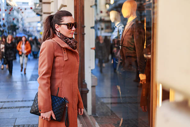 istock Girl looking at show-window 531140707