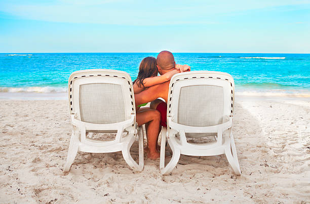 istock Couple relaxing on sunbed 531151719