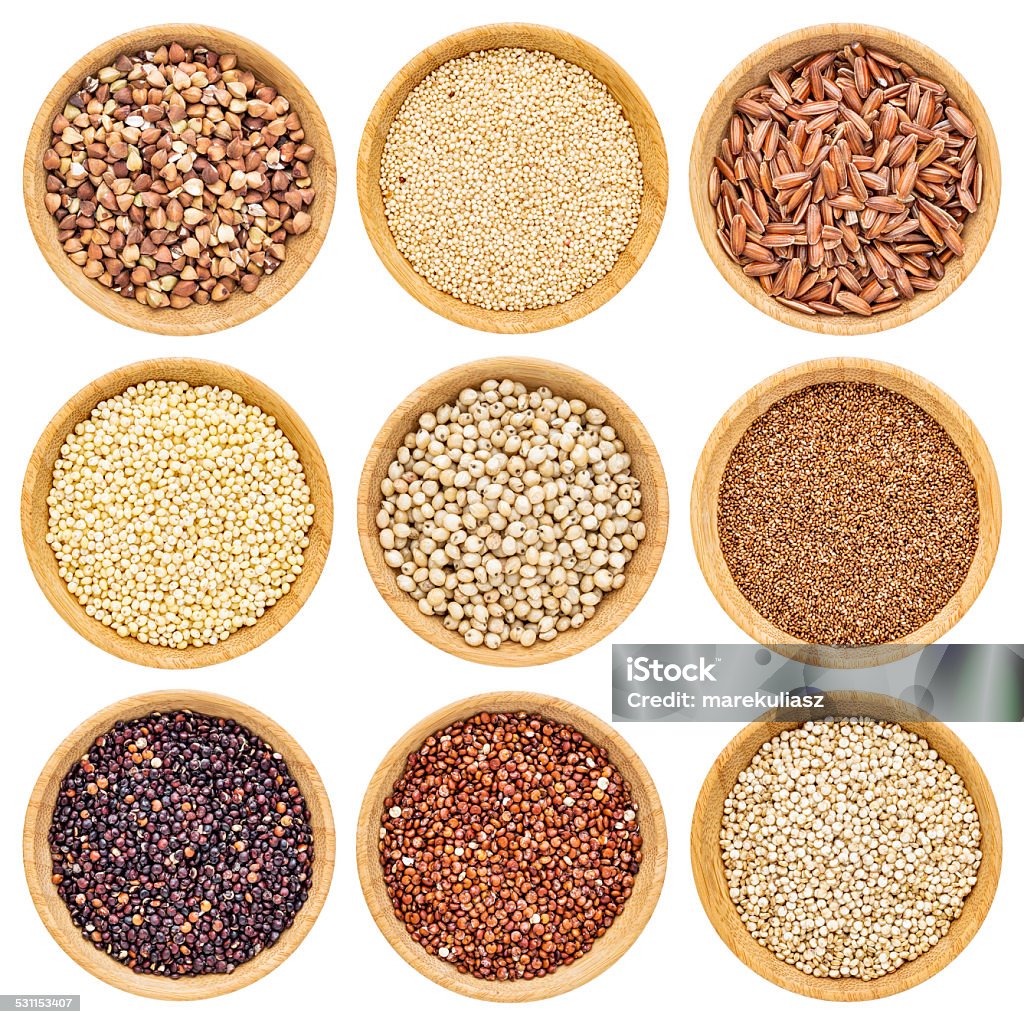 gluten free grains gluten free grains  - buckwheat, amaranth, brown rice, millet, sorghum, teff, black, red and white quinoa - isolated wooden bowls Quinoa Stock Photo