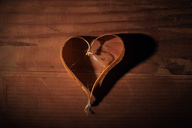 istock Autumn leaves background texture heart concept 531153833