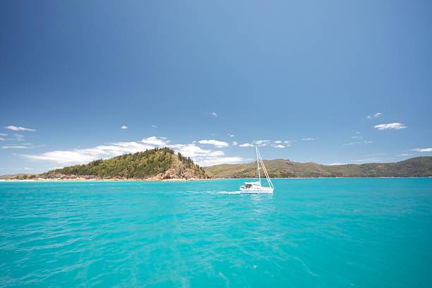 Yacht sailing through the whitsunday islands Australia, whitehaven beach