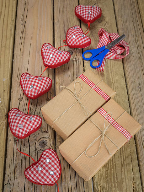 istock string and brown paper parcels with scissors, ribbon  and hearts 531162299