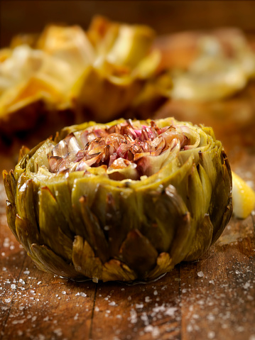 Roasted Artichoke stuffed with Garlic cloves and slow roasted with lemon Juice, Olive oil and course Sea salt-Photographed on Hasselblad H3D2-39mb Camera